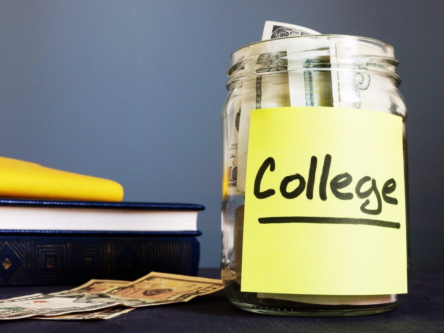 College fund written on a jar and money