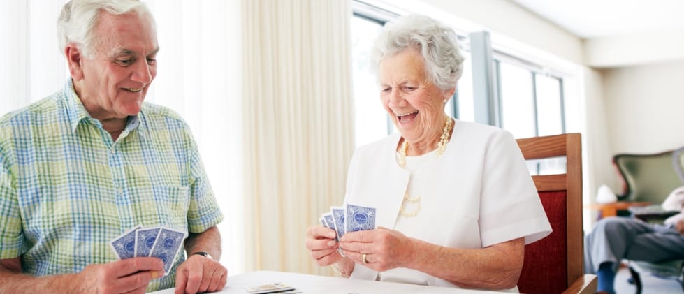 Retired couple playing cards